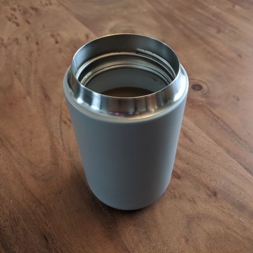 Thin lip mug with coffee in it