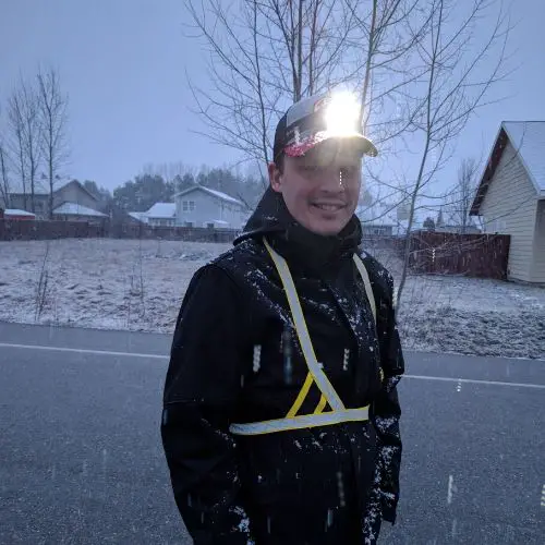 Headlamp on hat in the snow